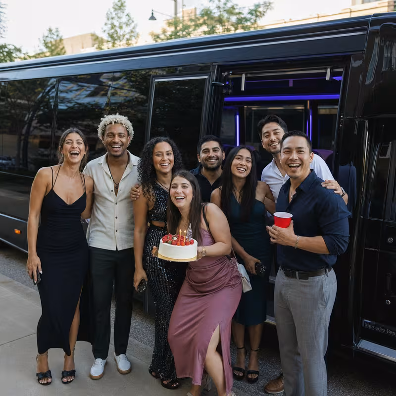 Party bus interior with wraparound leather seating and LED lighting in Brooklyn