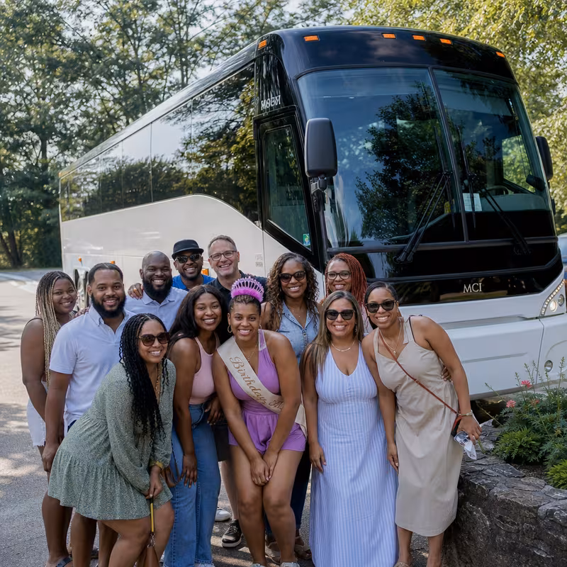 Passengers loading luggage while boarding an Brooklyn group shuttle