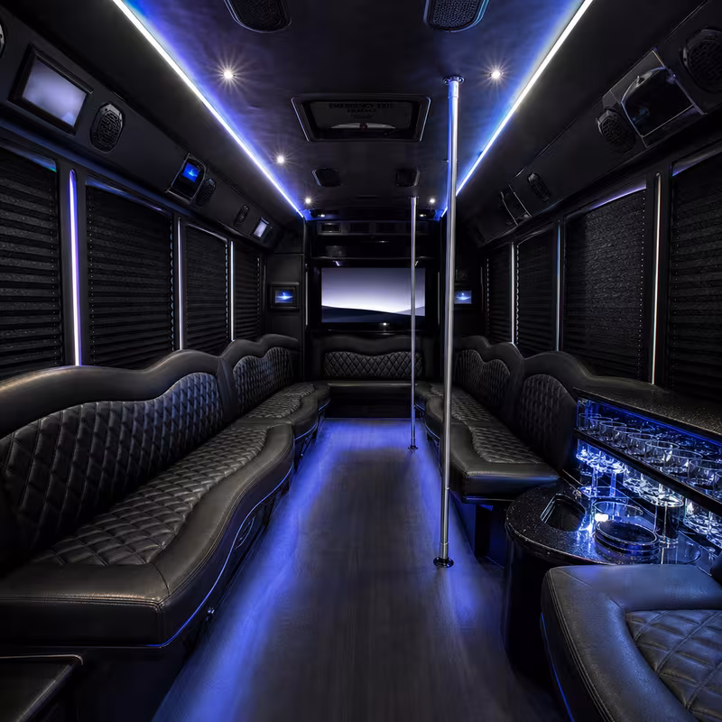 Party bus interior with wraparound leather seating and LED lighting in Brooklyn