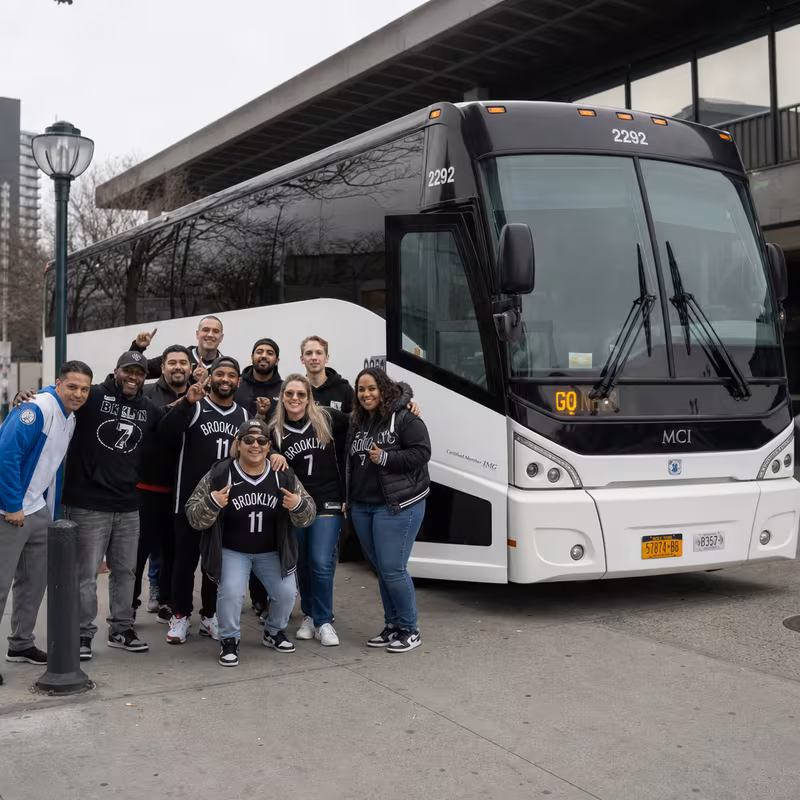 Passengers loading luggage while boarding an Brooklyn group shuttle