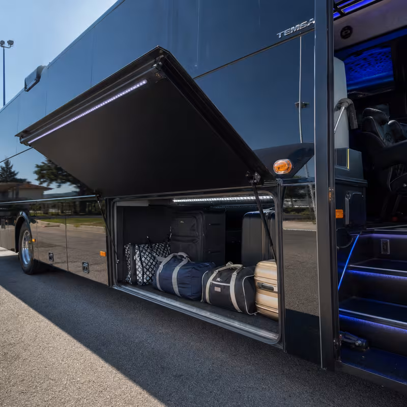 Party bus interior with wraparound leather seating and LED lighting in Brooklyn