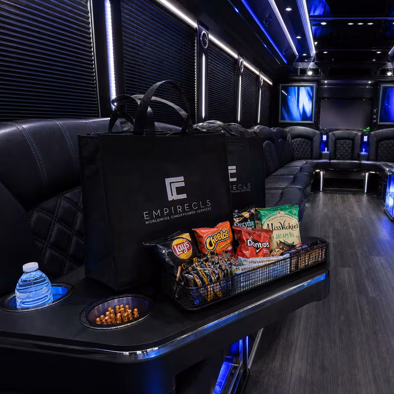 Party bus interior with wraparound leather seating and LED lighting in Brooklyn